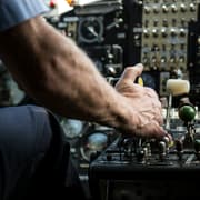 Pilot using plane controls